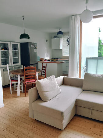 Open and welcoming living area connecting the kitchen and dining space