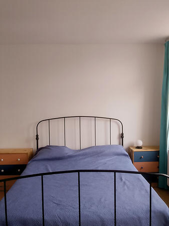 Bedroom with double bed and matching bedside tables